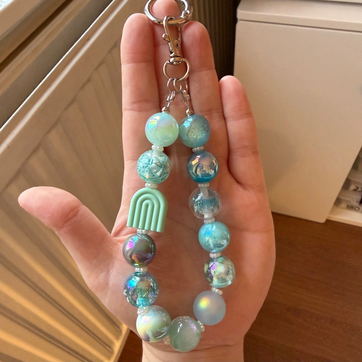 Telefoon/tassenhanger mint regenboog