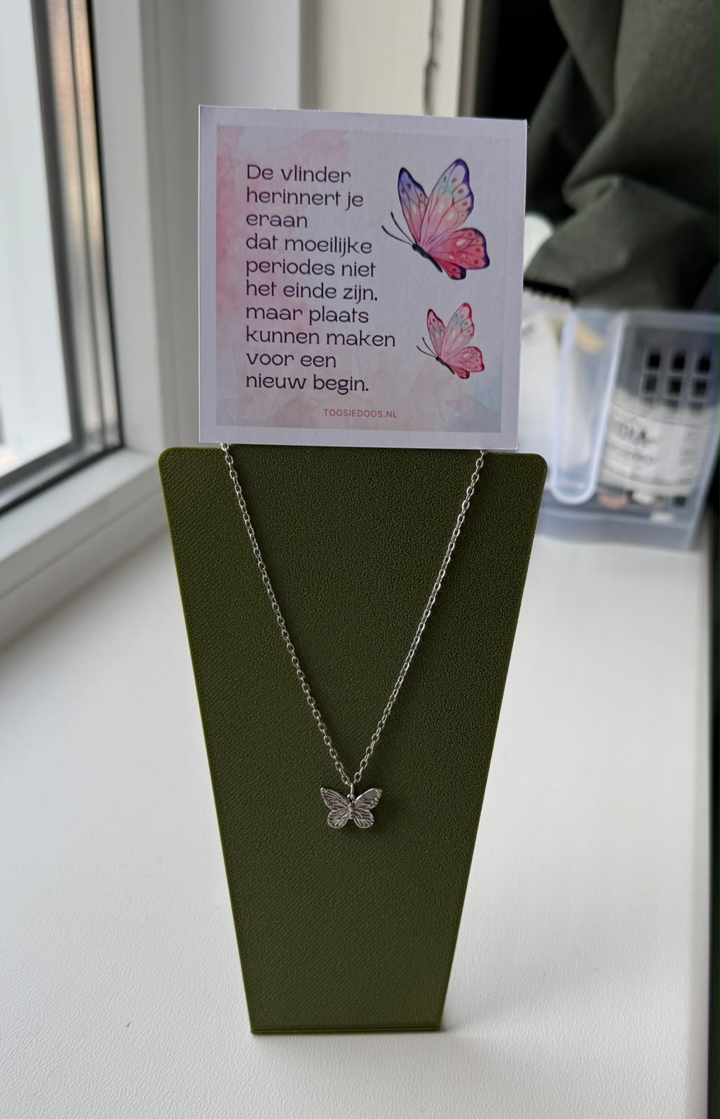 Troost vlinder ketting - zilver