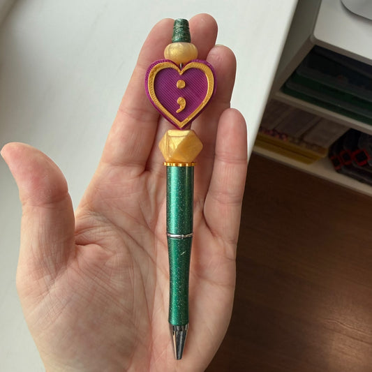 Semicolon paars/goud/groen